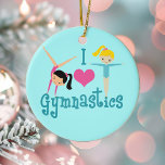 I Love Gymnastics Keramisch Ornament<br><div class="desc">Ik hou van gymnastiek. Een  gymnastiekmeisje cadeau met schattige blauwgroen tekst tussen twee schattige meisjes en een mooi roze hart. Een schattig gymnast cadeau voor een kinder of vrouwelijke gymnastiekcoach. Een brunette in een handgreep en een blond meisje met armen uitgestrekt.</div>