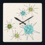 Iconic Atomic Starbursts Square Wall klok<br><div class="desc">Deze Iconische atoomstoot barst een vierkant acrylwand-klokpatroon (grote afdruk) met iconische atomaire sterrenbursts. Dat klopt! De oude school, crèmekleurige achtergrond met gouden spugen is de perfecte achtergrond voor de levendige turquoise, het kalkselderij en kitschy peren groene cirkels. De vlekken van kleur worden sporadisch geplaatst in diverse grootte met het bekleden...</div>