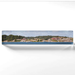 Idyllisch kustlandschap naambordje