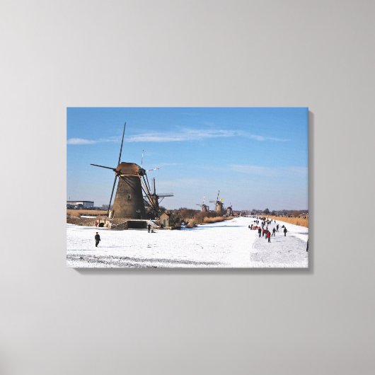 IJsschaatsen langs de windmolens in de winter Canvas Afdruk (Voorkant)