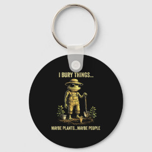 Ik begraaf dingen misschien planten misschien mens sleutelhanger