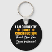 Ik ben momenteel in aanbouw sleutelhanger (Achterkant)