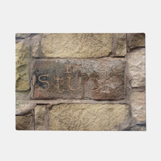 "Ik ben Stuck" een andere steen in de muur Deurmat (Voorkant)