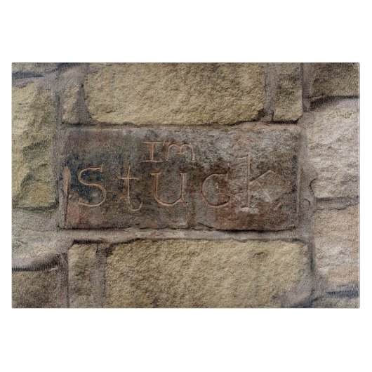 "Ik ben Stuck" een andere steen in de muur Snijplank (Voorkant)