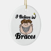 ik geloof tussen haakjes keramisch ornament (Rechts)