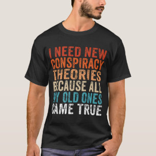 Ik heb nieuwe complottheorieën nodig. Mijn oude C- T-shirt