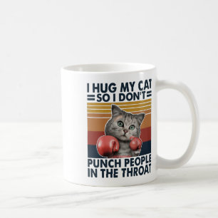 Ik hou mijn kat vast zodat ik geen mensen in de ke koffiemok