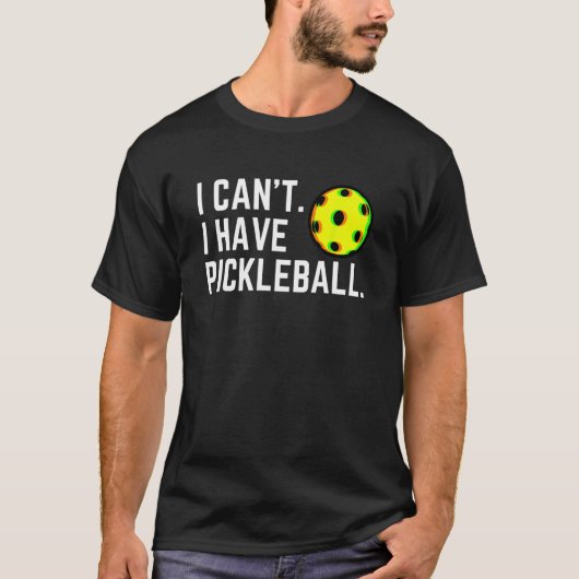 Ik kan niet laten Pickleball een balspeler kiezen T-shirt (Voorkant)