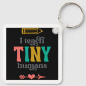 Ik leer kleine mensen sleutelhanger (Achterkant)