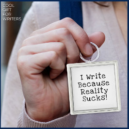 Ik schrijf omdat de werkelijkheid klote is met een sleutelhanger
