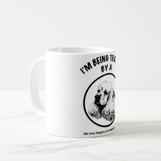 Ik word getraind door een Cocker Spaniel Koffiemok (Voorkant links)