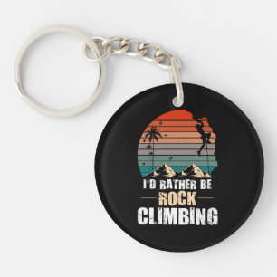 Ik zou liever rotsklimmen retro zonsondergang sleutelhanger