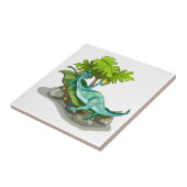 Illustratie van een Iguanodon zonnebaden. Tegeltje (Zijkant)