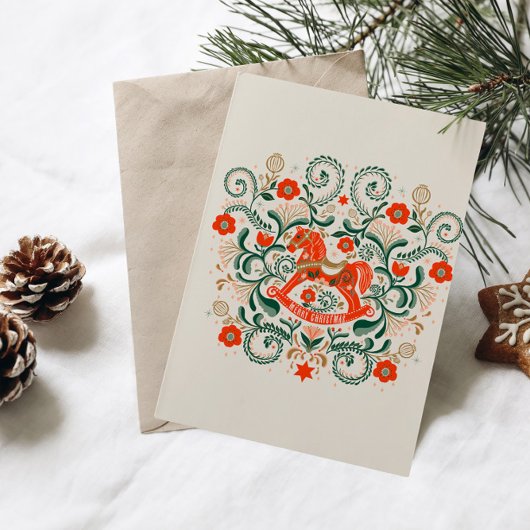 Illustratie van een vintage kerstschommelpaard feestdagenkaart