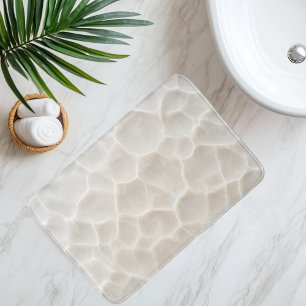 Imitatie strandsand onder helder water badmat