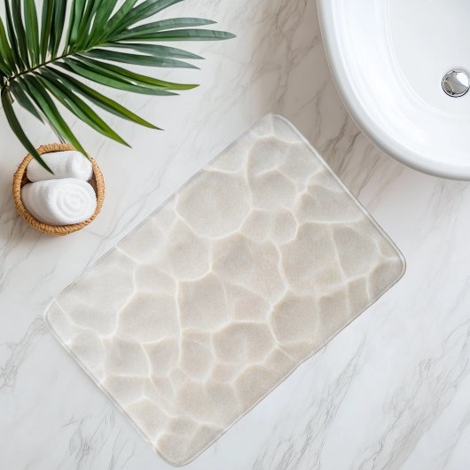 Imitatie strandsand onder helder water badmat