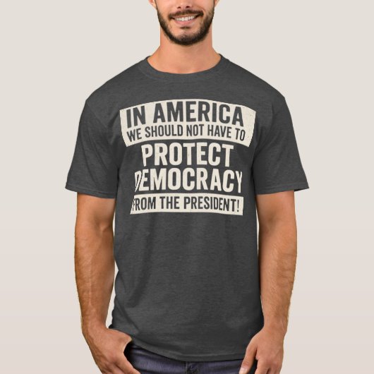 IN AMERICA WE SHOULD NOT HAVE TO PROTECT DEMOCRACY T-SHIRT (Voorkant)