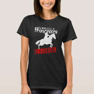 In Eén Wereld Vol Prinsessen Wees Eén Cowgirl Co T-shirt