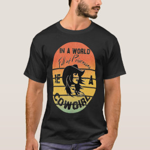 In Eén Wereld Vol Prinsessen Wees Een Cowgirl,  Co T-shirt