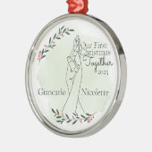 In elkaar grijpende handen eerste kerst samen metalen ornament (Links)