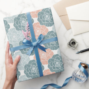 In elkaar grijpende turquoise en koraalrode cameli cadeaupapier