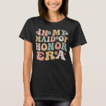In My Maid of Honor Era Groovy bruidsmeisje bruilo T-shirt<br><div class="desc">Retro groovy in mijn maid of honour-tijdperk is een ideaal cadeau voor zus van de beste zussen om te worden gepromoveerd tot maid of honour om kippennacht,  vrijgezellenfeest,  vrijgezellenfeesten voor zussen te vieren. Grappige grote zus paarse en zwarte meid van eer voorstel aanwezig</div>