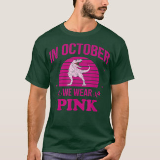 In oktober Draag we roze dinosauriërs met een bors T-shirt