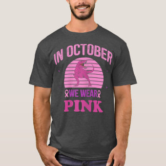 In oktober Draag we roze dinosauriërs met een bors T-shirt