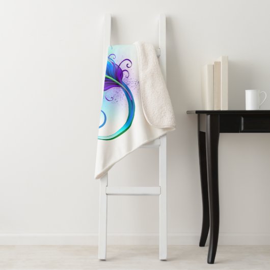 Infineensymbool met regenboogvanger sherpa deken (In situ)