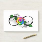 Infiniteitssymbool met regenboogRoos Post-it® Notes (Op bureau)