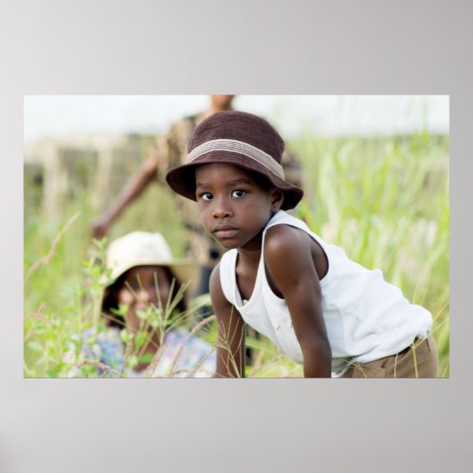 Injured child in the grass. poster (Voorkant)