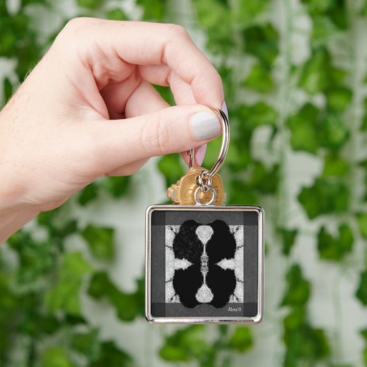 Inkte kraai sleutelhanger (Hand)