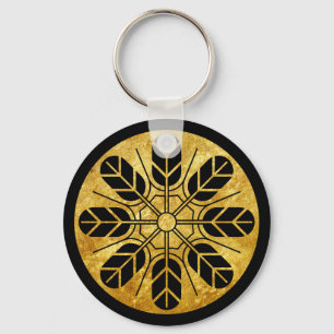 Inoue clan kamon in faux gold op zwart goud sleutelhanger