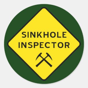 Inspecteur Sticker in Sinkhole