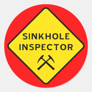 Inspecteur Sticker in Sinkhole
