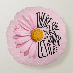 Inspirerende quote en roze margriet rond kussen