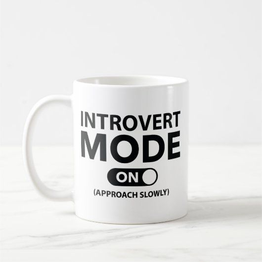 Introvert-modus ingeschakeld koffiemok (Links)