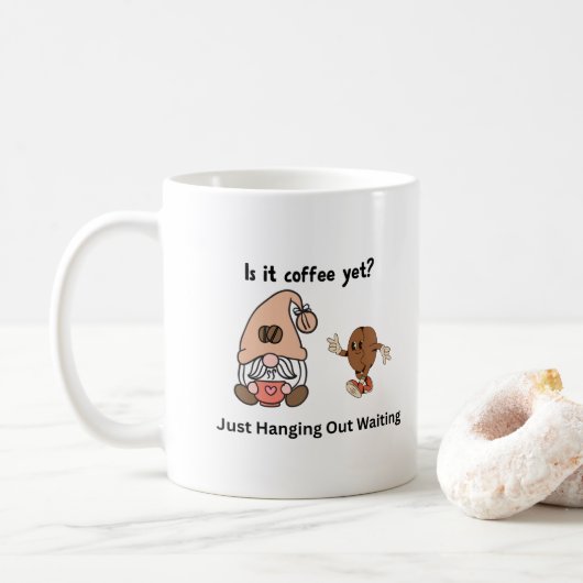Is het al koffie met een gnoom op een koffiekopje? koffiemok (Met donut)