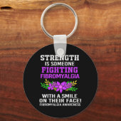 Is iemand die vecht tegen fibromyalgie voor vrouwe sleutelhanger (Voorkant)
