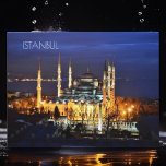 Istanbul Blauwe Moskee Nachtlandschap Premium Reiz Briefkaart<br><div class="desc">Dompel jezelf onder in de magie van Istanbul. Dit fascinerende ontwerp is voorzien van de iconische Blauwe Moskee (Sultanahmet Camii) badend in de etherische gloed van de nacht. Ervaar de grandeur van de Ottomaanse architectuur en de spirituele ambiance van een van de meest gerespecteerde bezienswaardigheden van Turkije. Perfect voor reizigers,...</div>