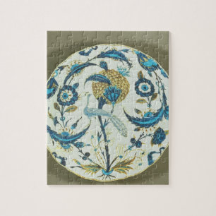 Iznik gerecht geschilderd met een pauw tussen fl legpuzzel