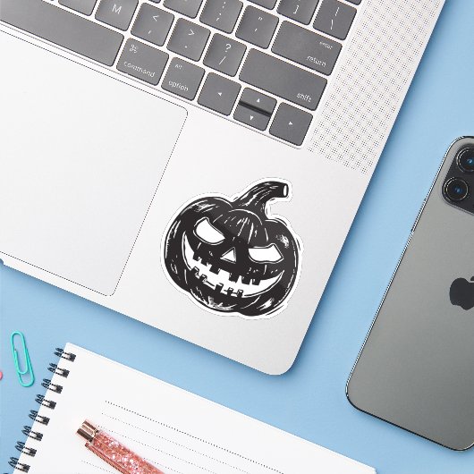 Jack-o'-lantern vinyl sticker (Laptop met iPhone)