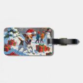 Jack Russell loopt in de sneeuw met kerstmuts Bagagelabel (Achterkant horizontaal)