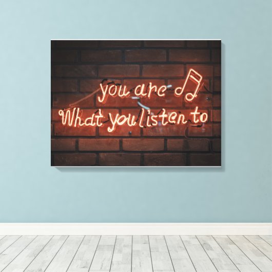 "JE BENT WAT JE LUISTERT NAAR" NEON LICHT TEKEN CANVAS AFDRUK (Insitu (Houten vloer))