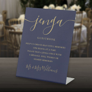 Jenga-huwelijksgastenboekscript in marineblauw en  reclamebord met voetstuk
