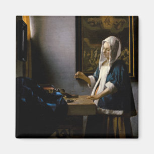 Johannes Vermeer - Woman Holding a Balance Magneet