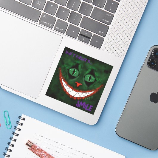 Joker Cheshire Sticker (Laptop met iPhone)