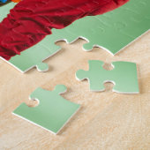 Jonge jongen die kerstverlichting rond een hond wi legpuzzel (Zijkant)