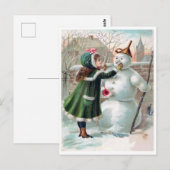 Jonge meid maakt een sneeuwman, een  vakantie briefkaart (Voorkant / Achterkant)