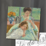 Jonge moeder naaien | Mary Cassatt Magneet<br><div class="desc">Young Moeder Sewing (1900) van de Amerikaanse impressionist Mary Cassatt. Het originele kunstwerk is een oliesschilderij op canvas. Het portret toont een moeder die met de hand naait,  terwijl haar jonge kind dicht bij haar schoot leunt. Gebruik de ontwerphulpmiddelen om douanetekst toe te voegen of het afbeelding te personaliseren.</div>